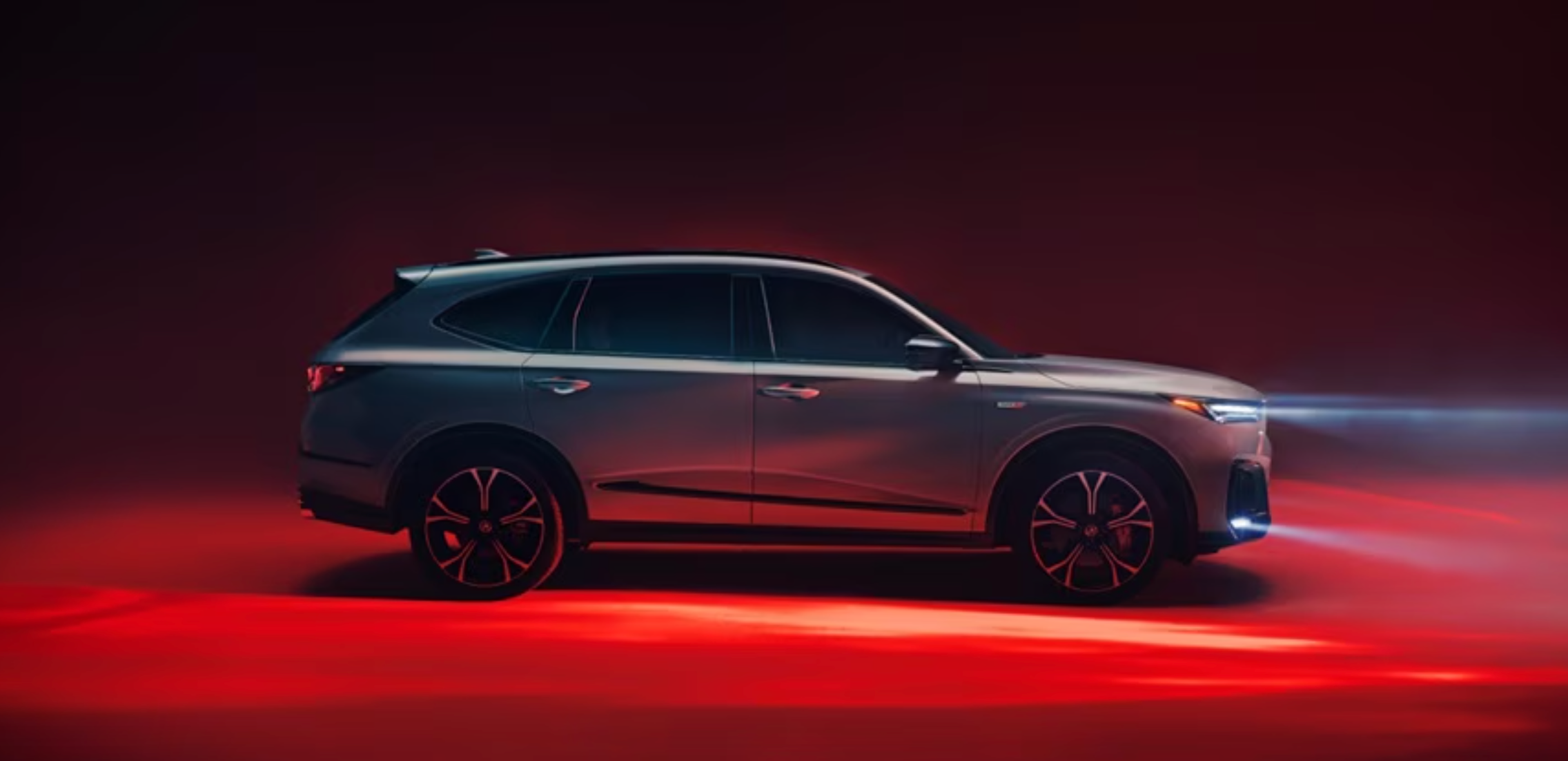 New Acura MDX in a red spotlight 